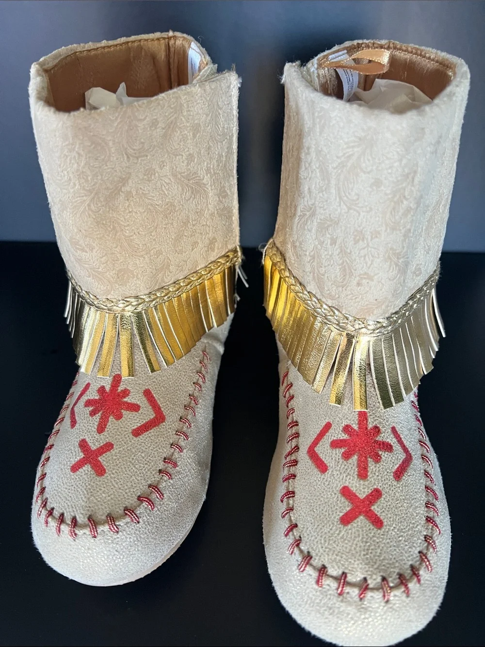 Disney Beige Moccasin Boots with Gold Fringe and Red Embroidery